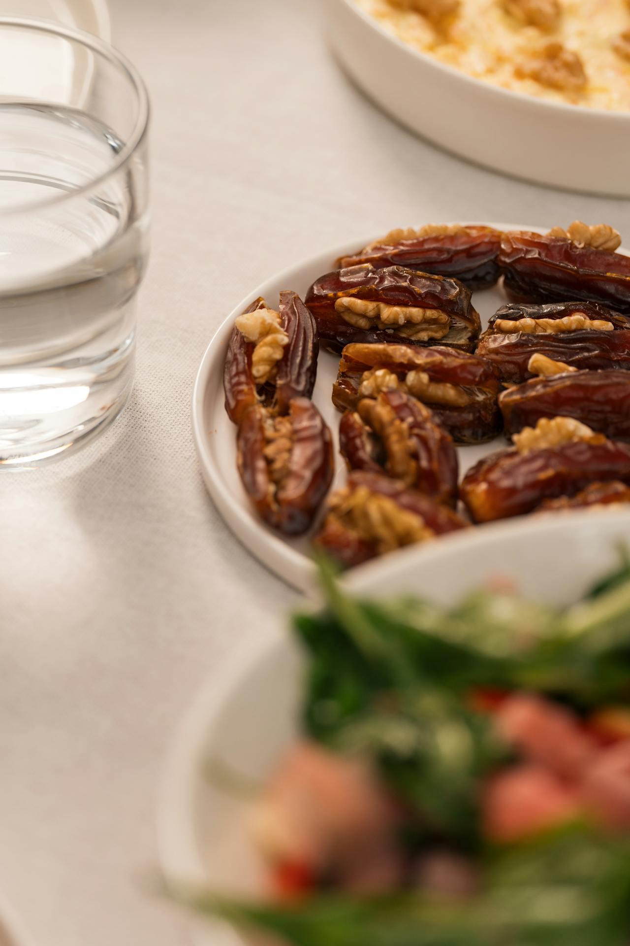 Dates with walnuts and a glass of water in the traditional sunnah pairing for breaking fast
