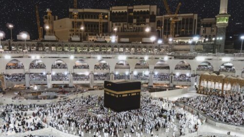 Pilgrims at the Kaaba in Masjid al-Haram during dawn prayer in Makkah